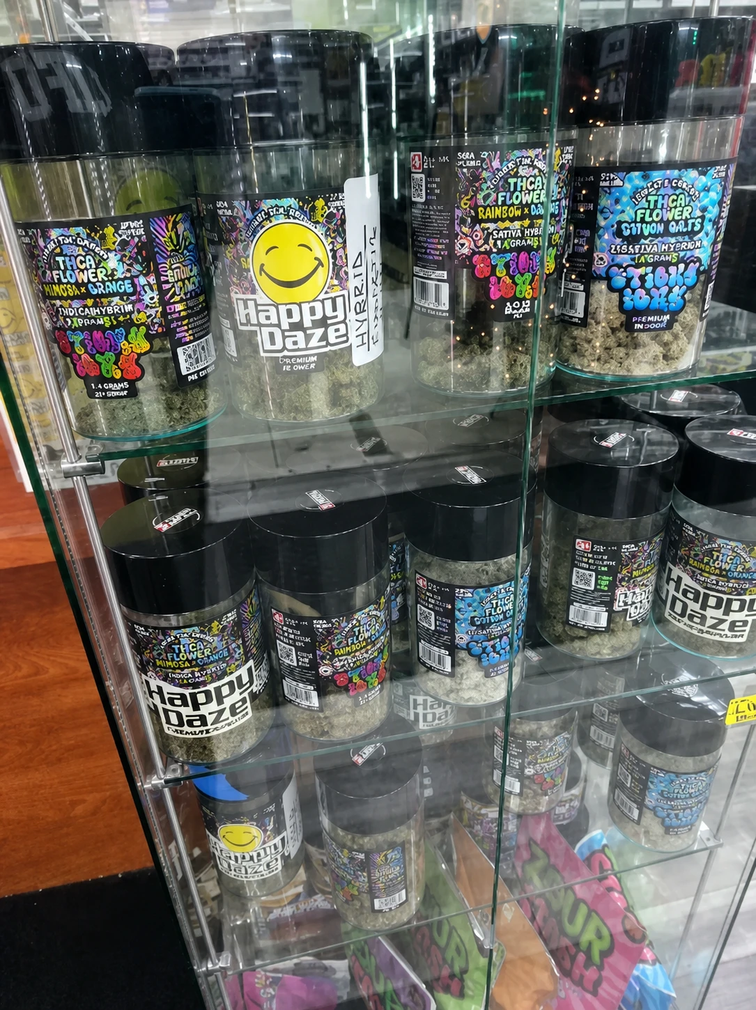 Happy Daze flower jars in a display case